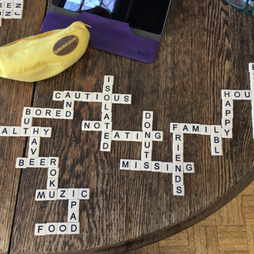 Photo of bananagram tiles on a wood table