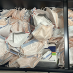 A photo of a drawer full of PPE masks