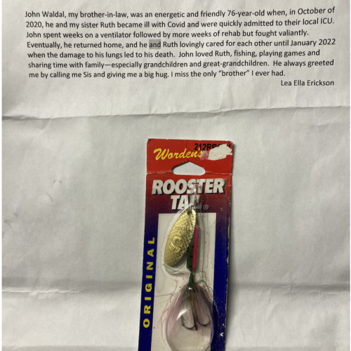 Photo of a fishing fly and a typed story