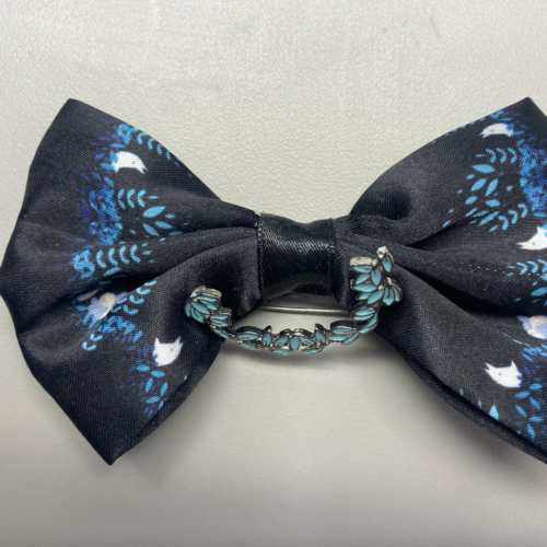 A black and floral bow barrette