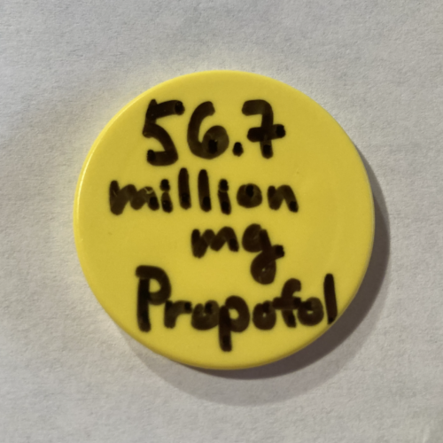 Image of a yellow button with the words 